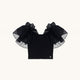 Top nero con volant